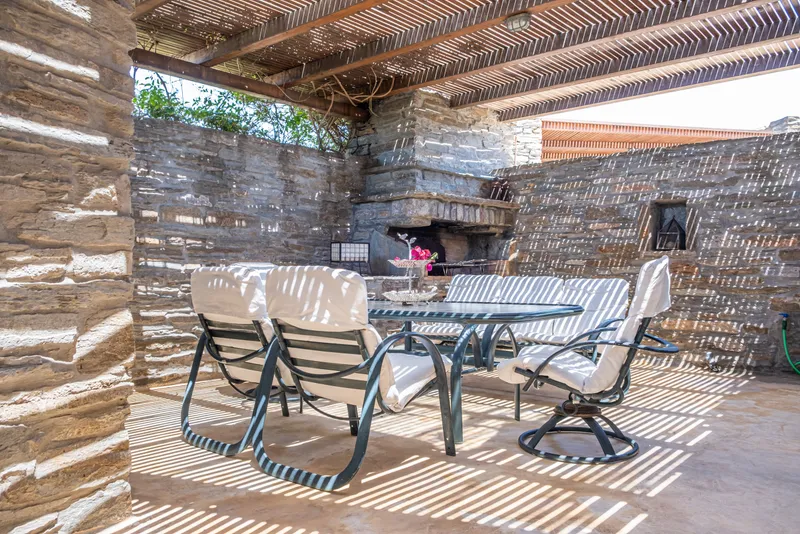BBQ courtyard set for an alfresco dinner with garden lighting