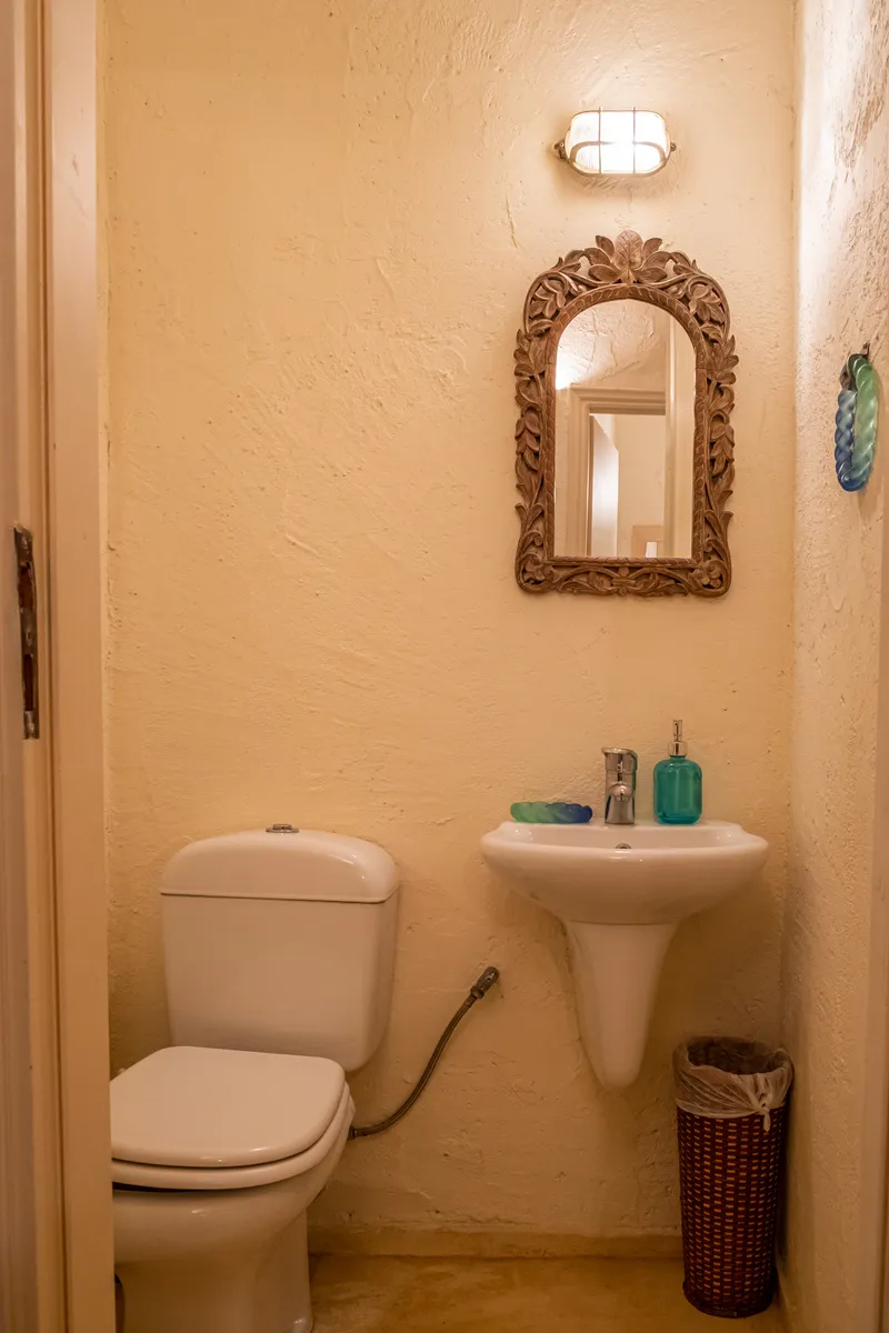Guest WC with traditional Cycladic tilework and vessel sink