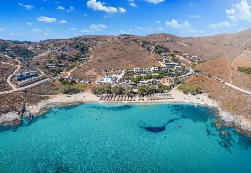Aerial view of Koundouros bay, Kea, with its sandy beach and turquoise water below the hillside