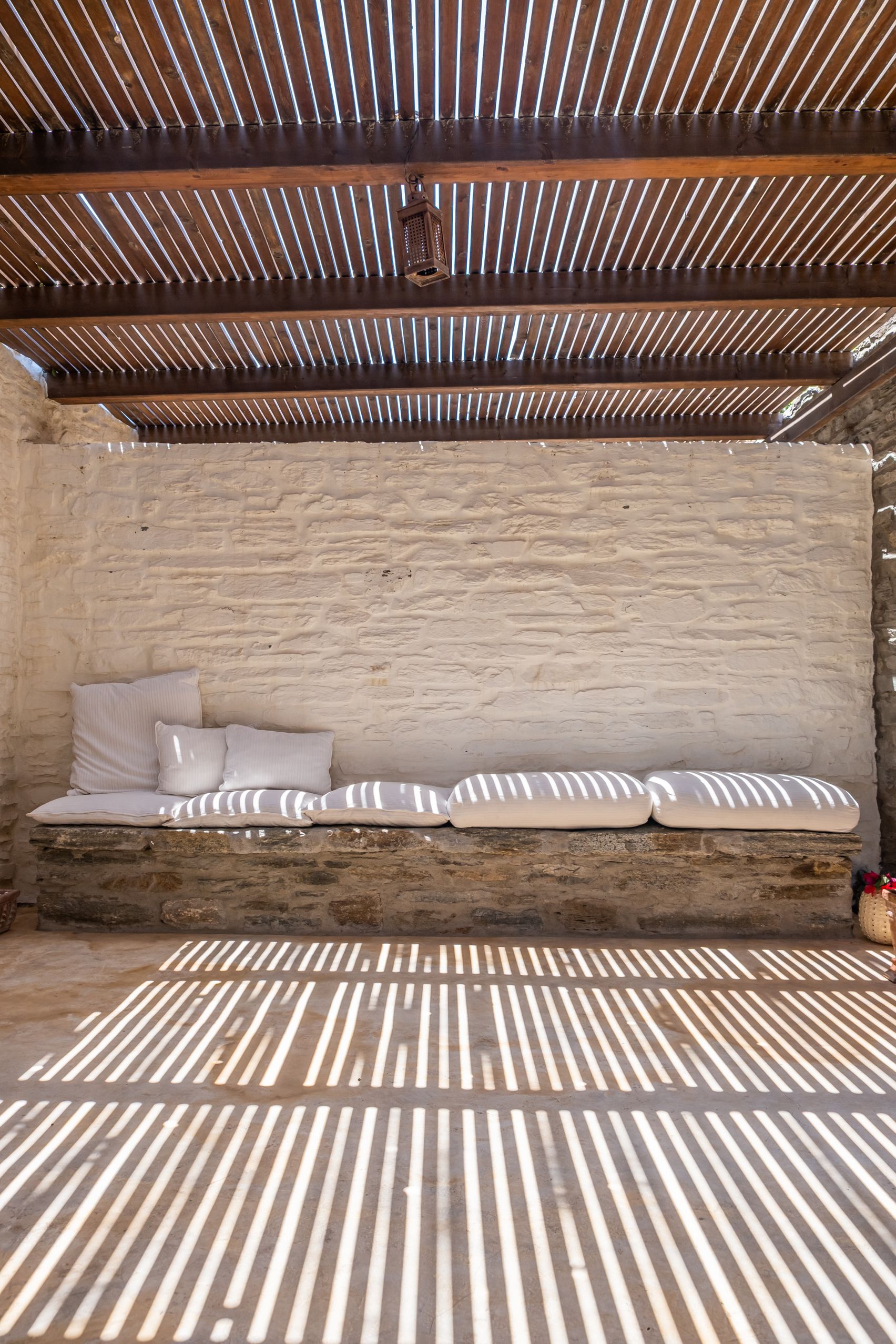 Couch area in the living room with stone wall detail