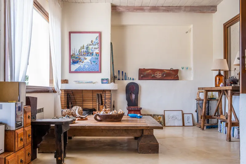 Living room dining area with natural light from garden-facing windows